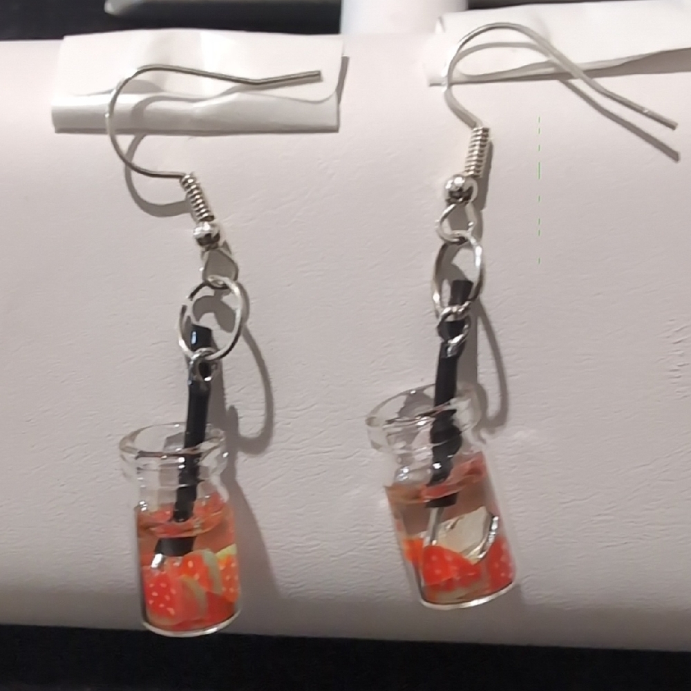 pair of miniature strawberry cocktail earrings in a mason jar